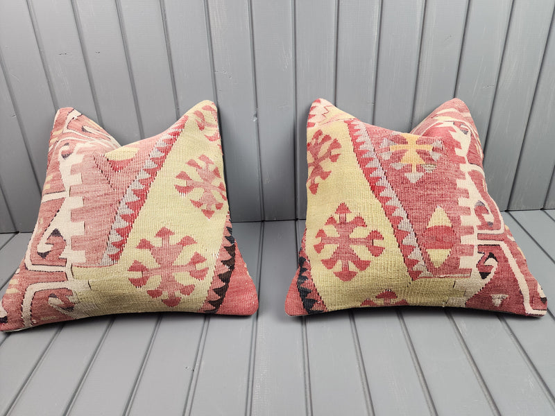 Vintage Turkish kilim pillow covers in coral pink and butter yellow