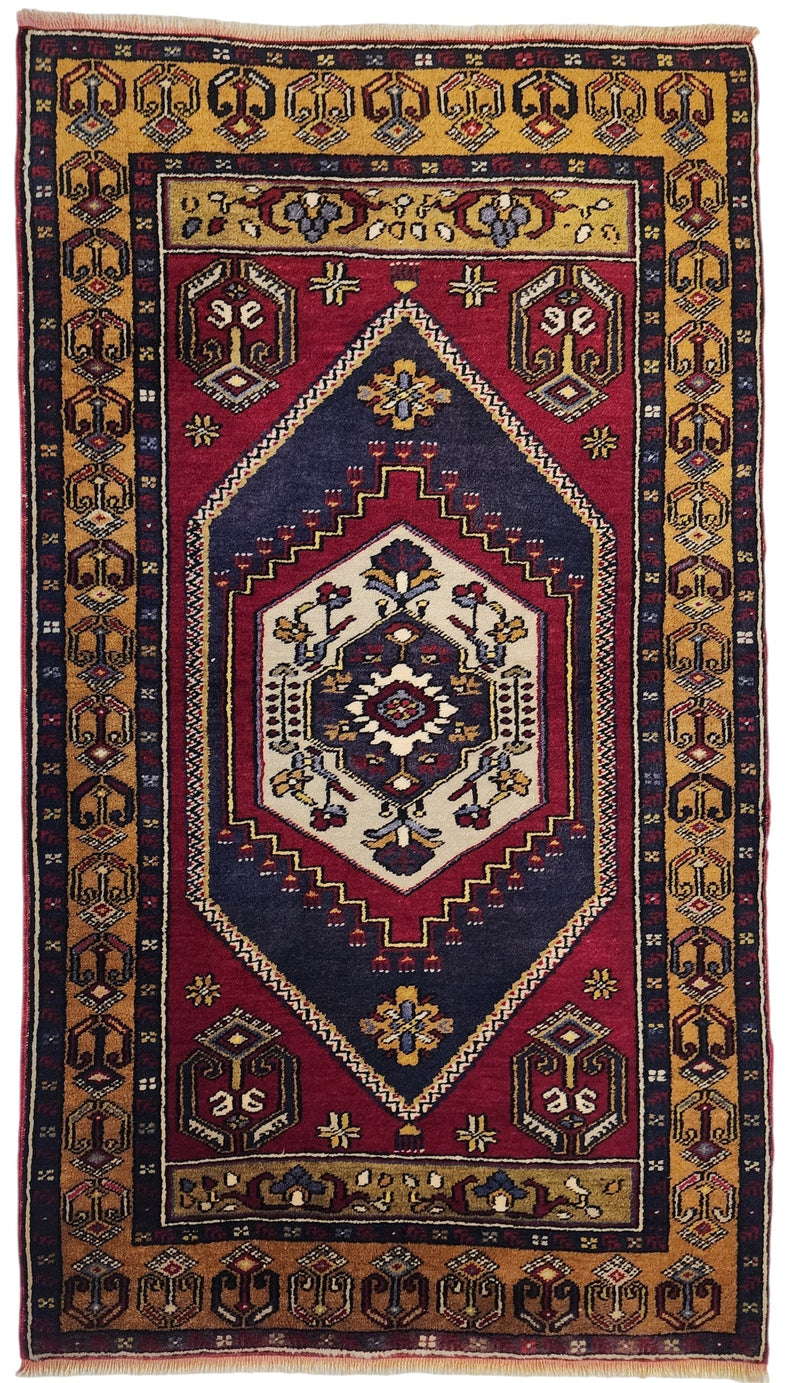 Vintage hand-knotted Yahyalı rug in red, blue and yellow