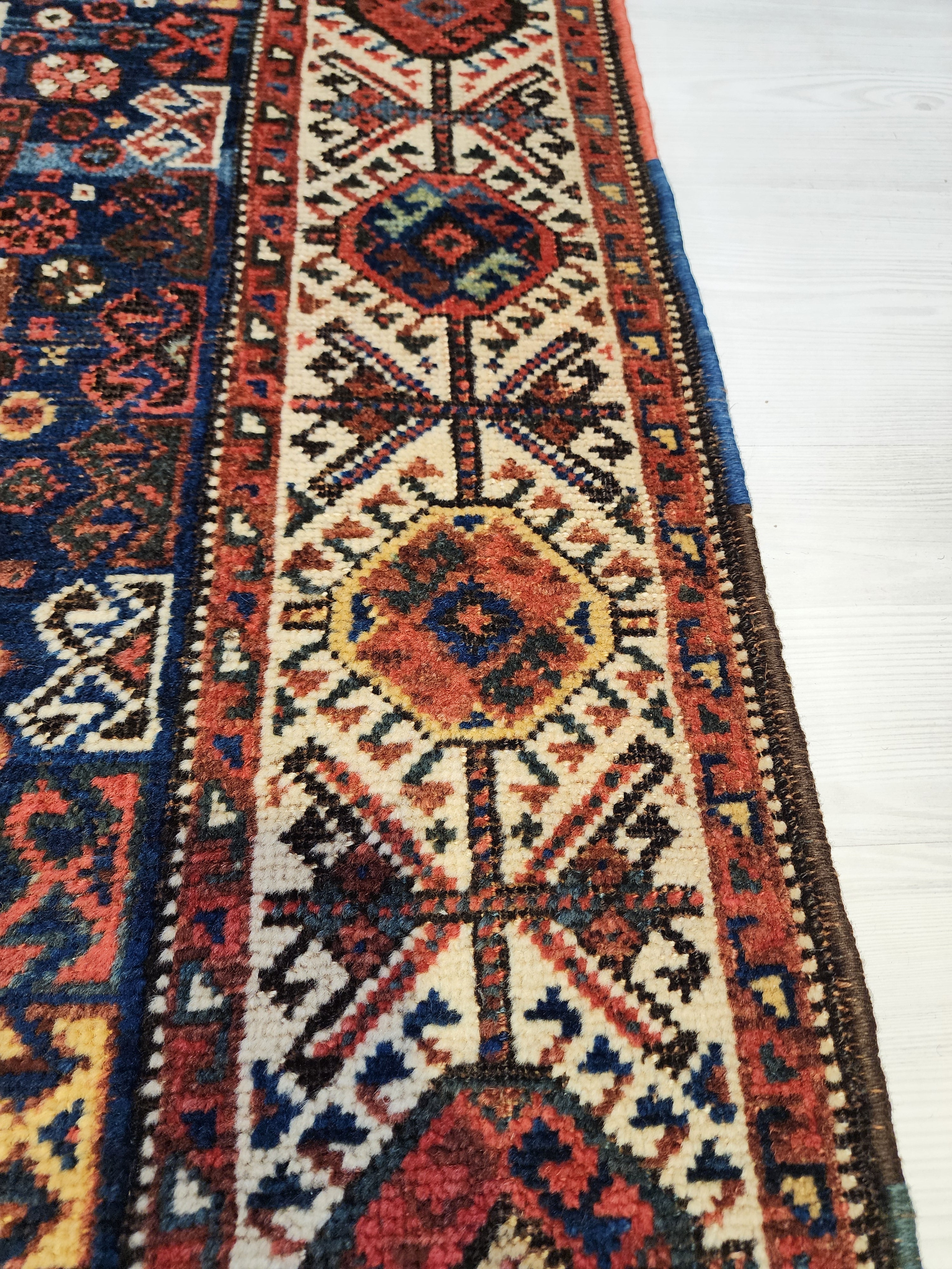 antique Caucasian Shirvan Wool Large Area Rug — styled view