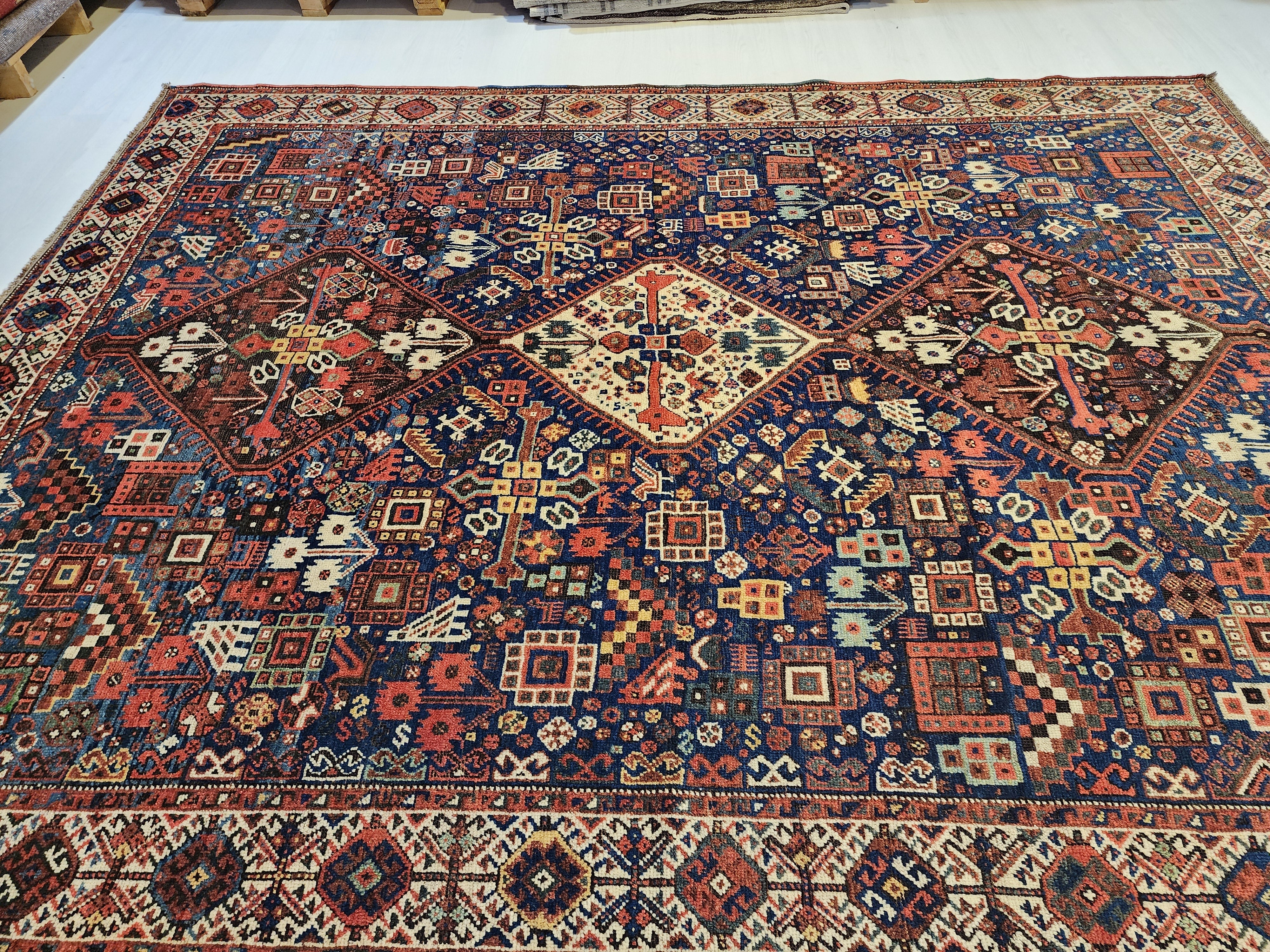 antique Caucasian Shirvan Wool Large Area Rug — styled view