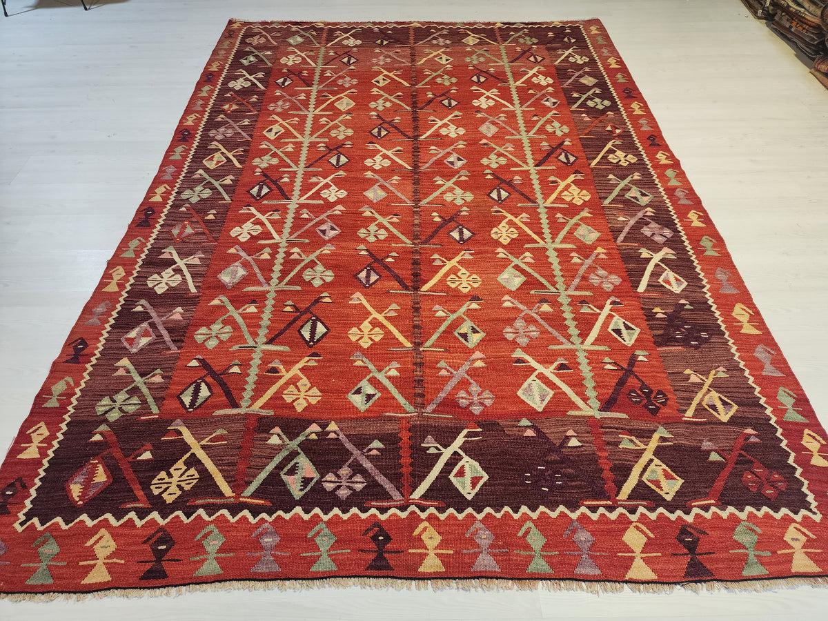 Antique Göçmen kilim rug in red, purple and green, 6'10" x 9'8", full view