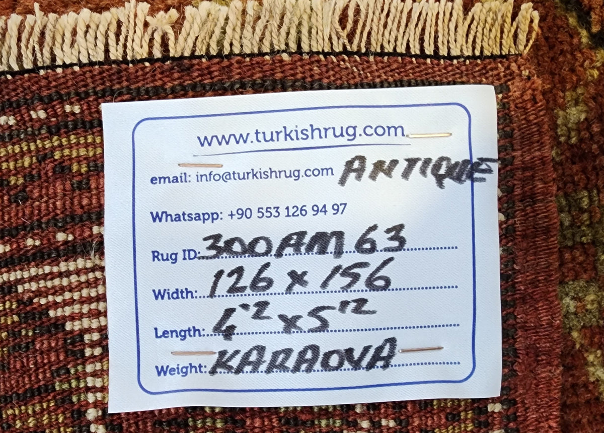 Antique Karaova prayer rug in red, brown and beige, 4'2" x 5'2", back of the rug with the hand-written label