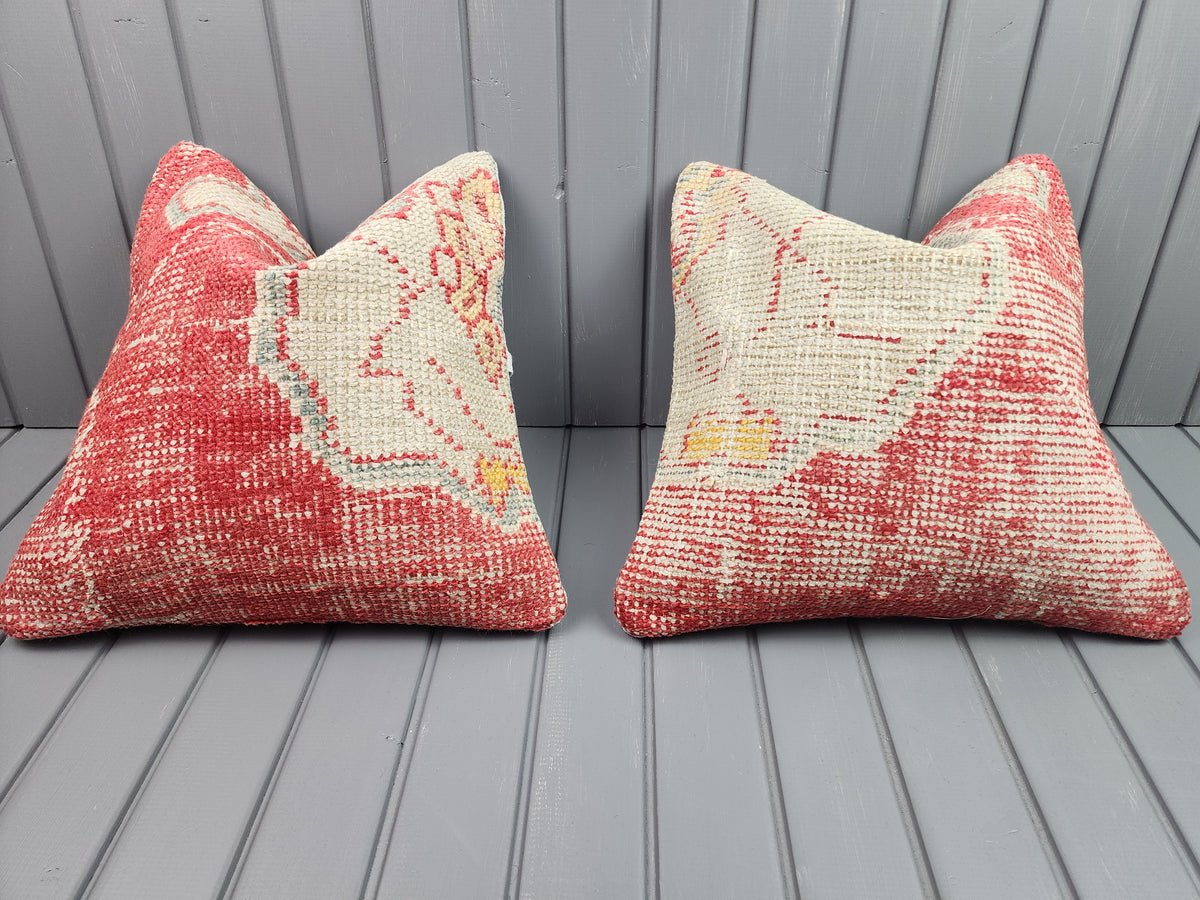 Antique Oushak rug pillow covers, set of 2, red and ivory, 16x16 in, pair, front view