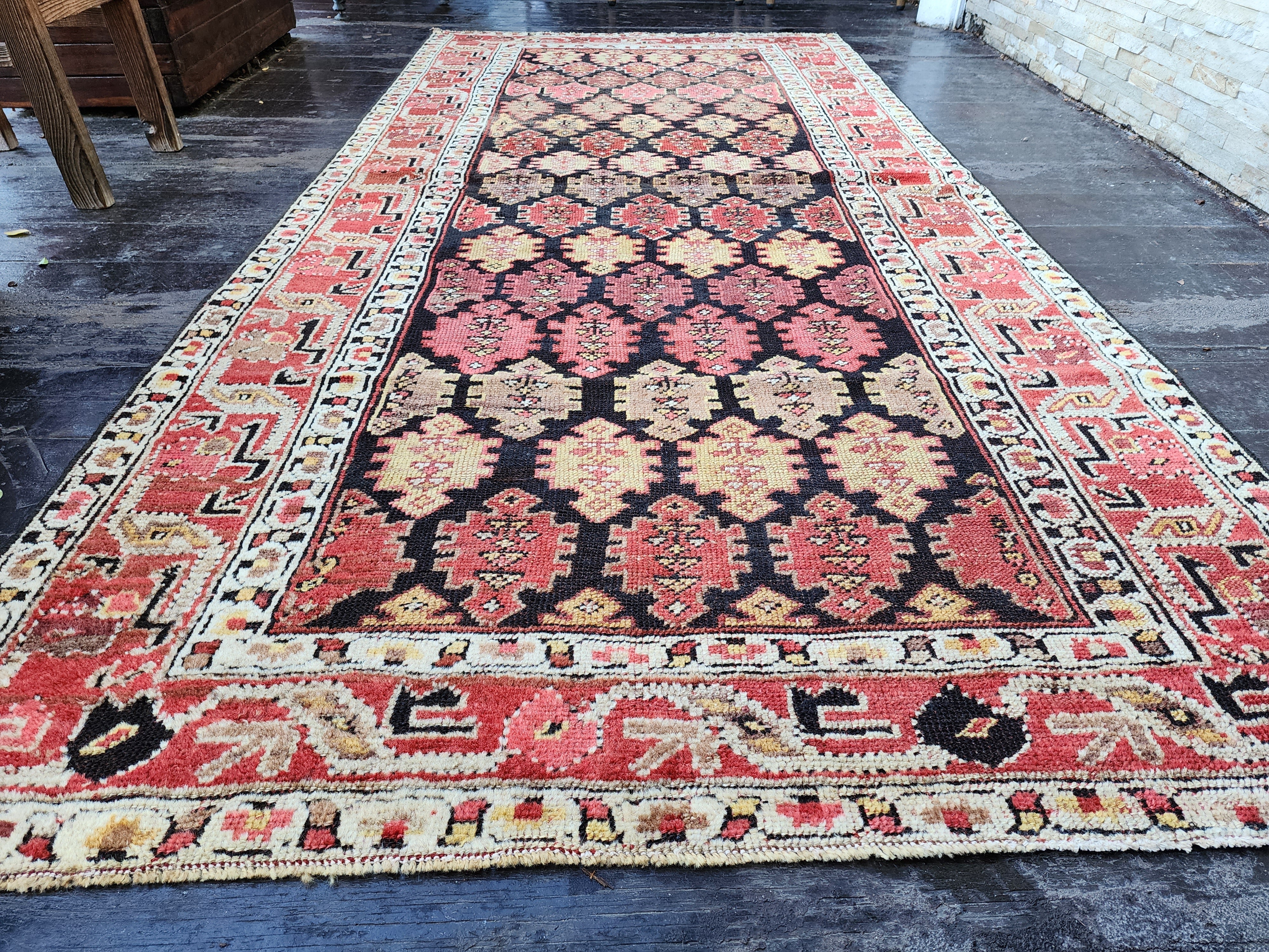 antique Caucasian Wool Area Rug — styled view