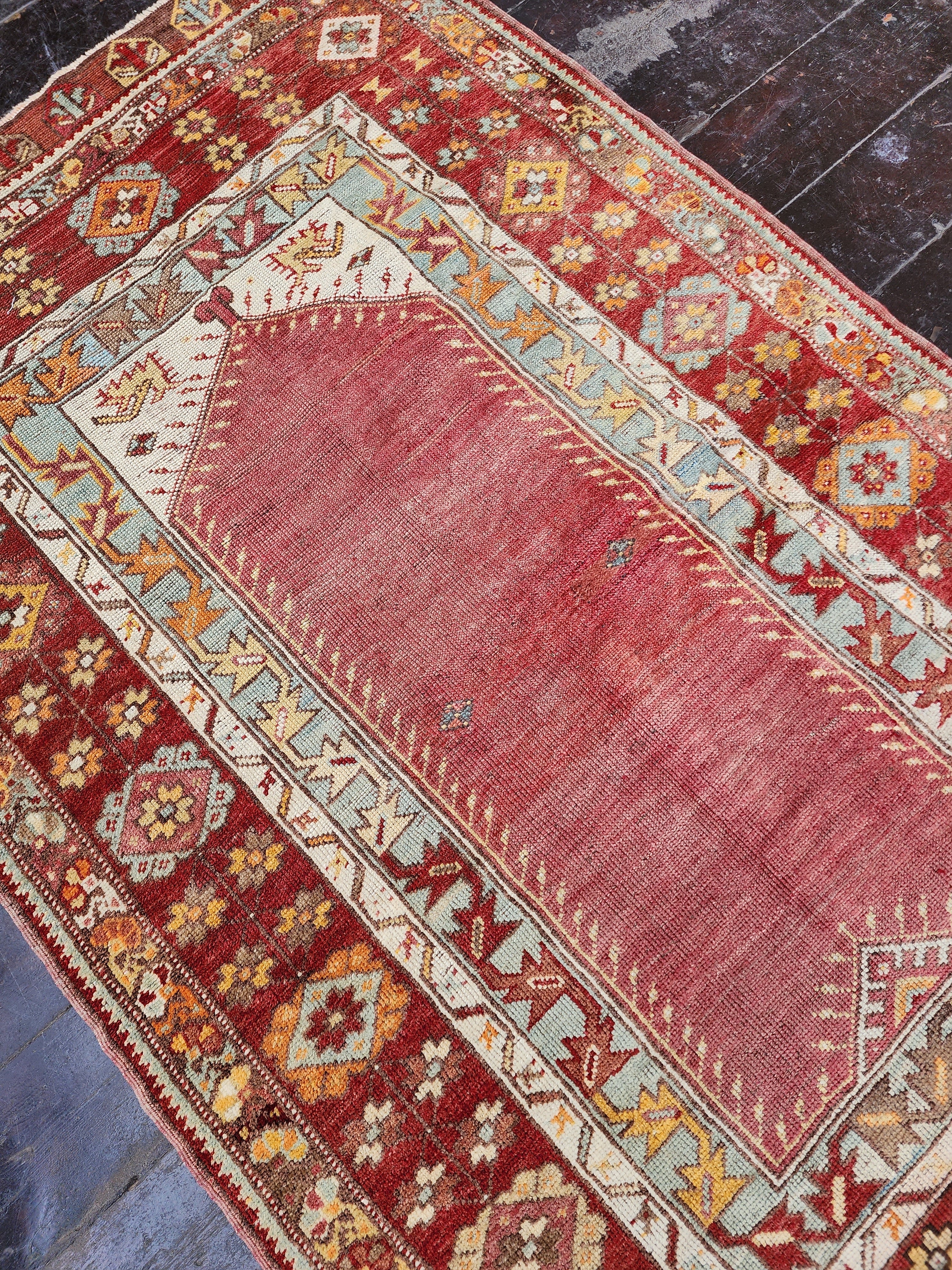 antique Konya Wool Small Rug — in setting