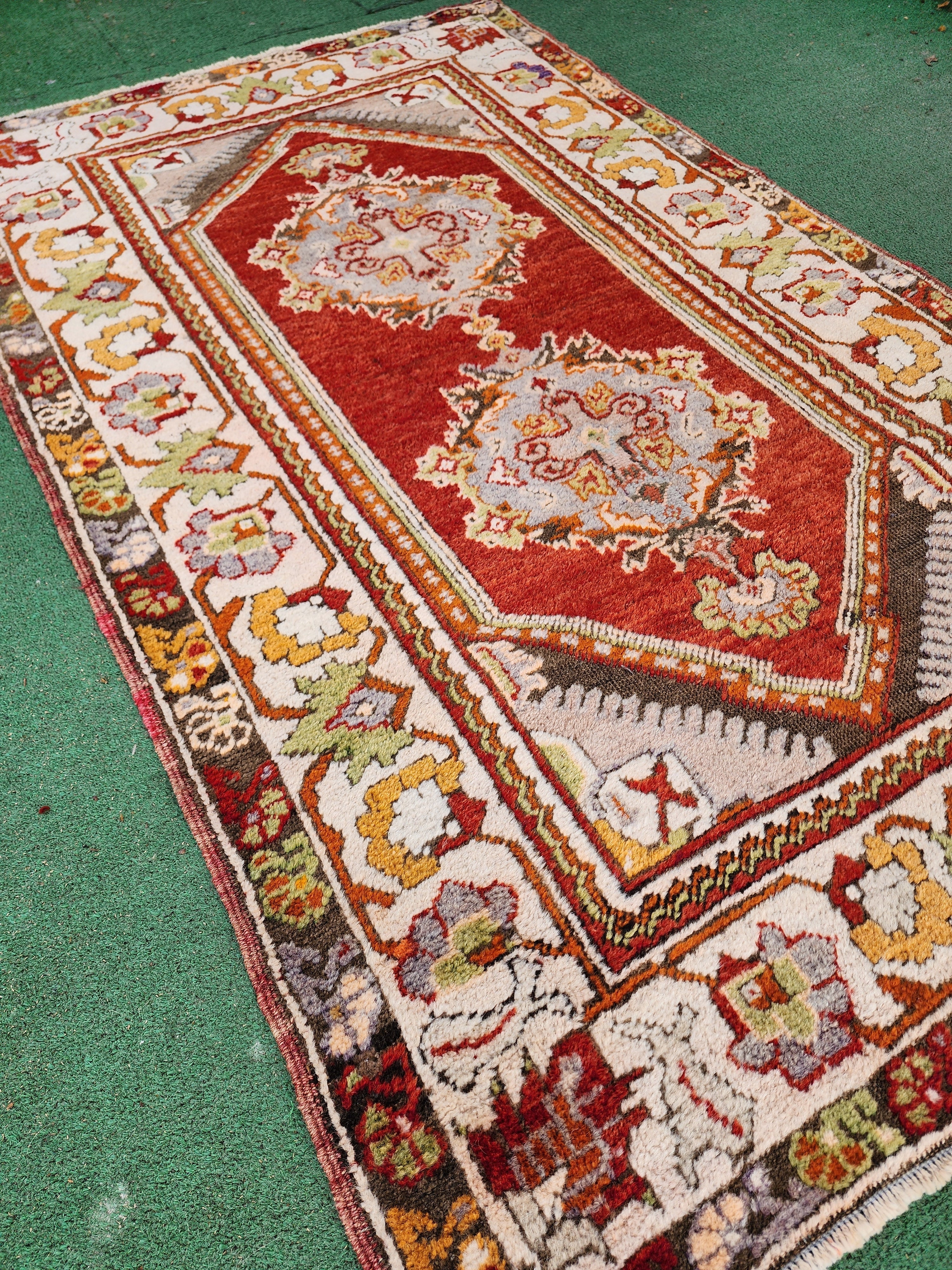 antique Milas Small Rug — back view