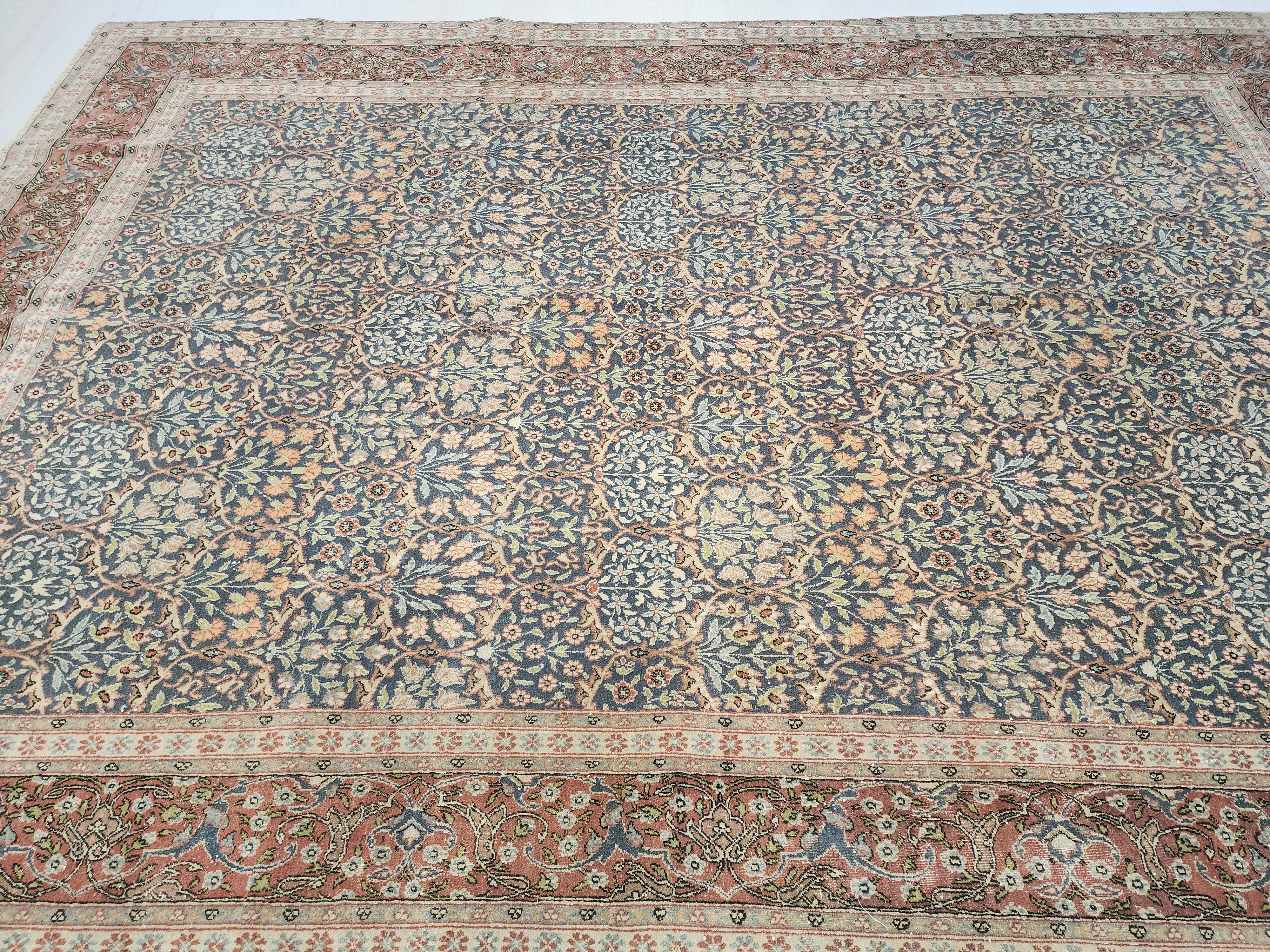 antique Hereke Wool Area Rug — styled view