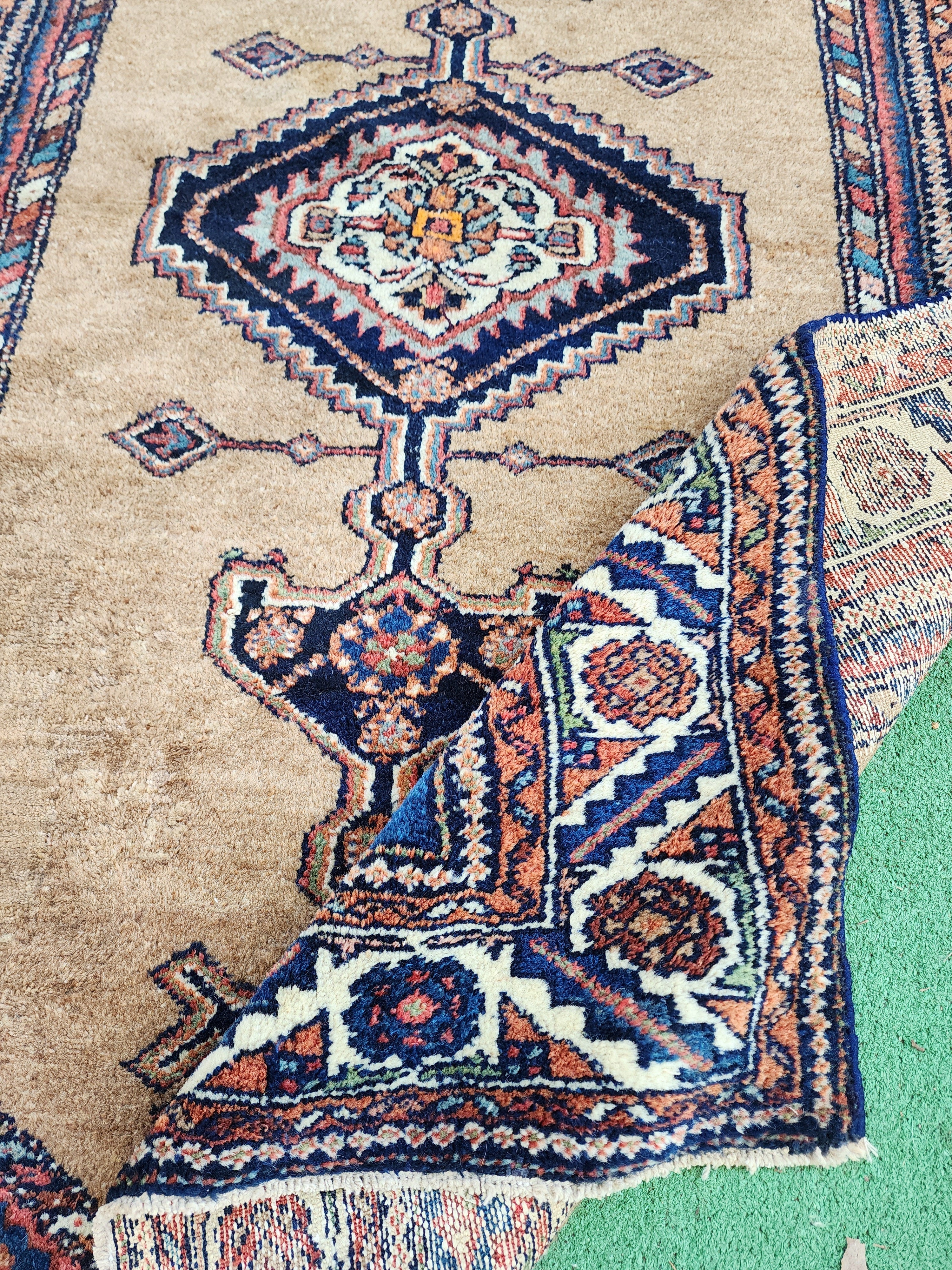 antique Persian Wool Small Rug — styled view