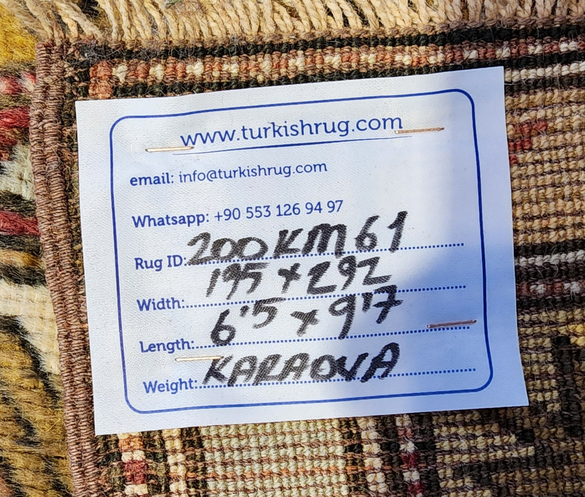 Vintage Karaova rug in beige, pink and yellow, 6'5" x 9'7", back of the rug with the hand-written label