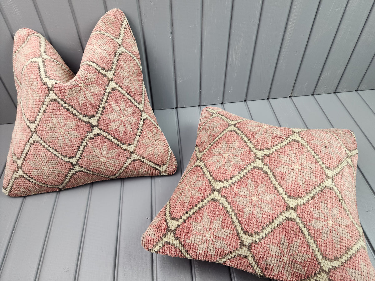 Vintage Oushak rug pillow covers, set of 2, pink, 16x16 in, one cover laid flat