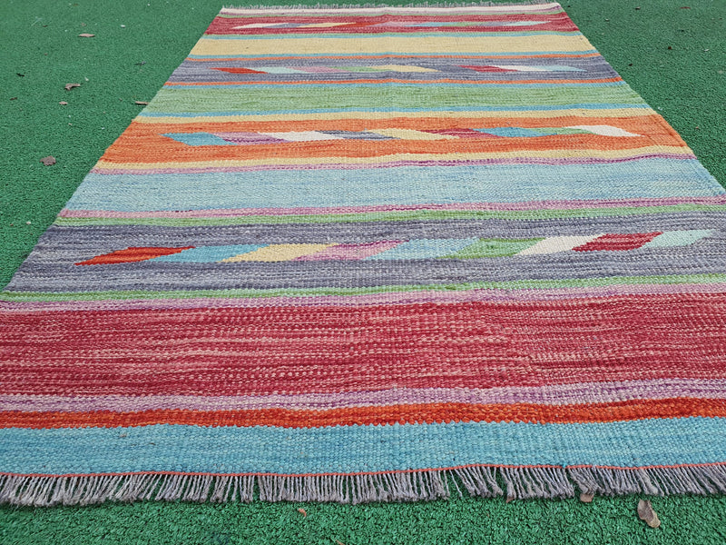 Vintage Oushak rug from Anatolia — soft palette and floral medallion