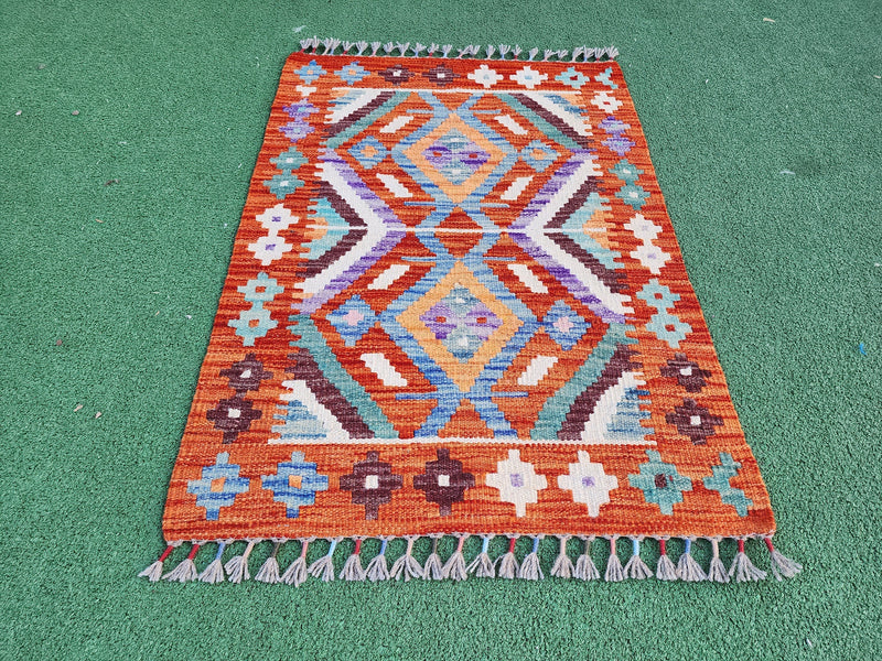 Vintage wool rug, well-cared-for, showing decades of gentle use