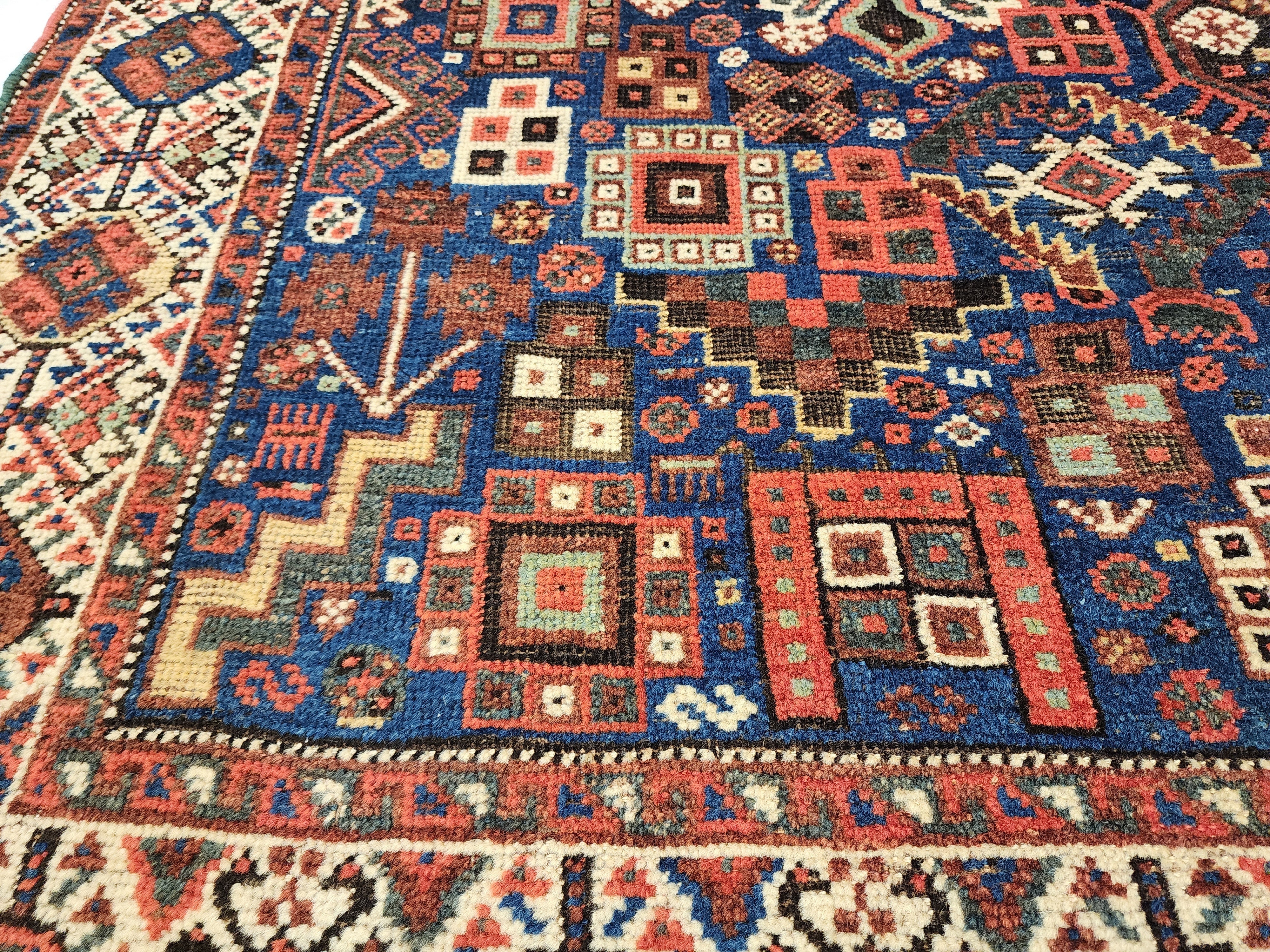 antique Caucasian Shirvan Wool Large Area Rug — styled view