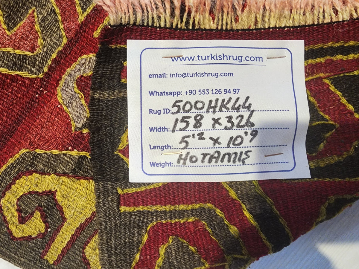 Antique Hotamış kilim rug in red and green, 5'2" x 10'9", back of the rug with the hand-written label