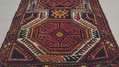 Vintage Yörük rug in red, blue and orange, 1'8" x 3'1", video