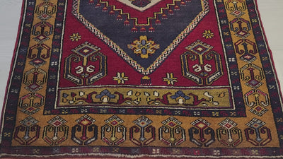 Vintage Yahyalı rug in red, blue and yellow, 3'2" x 5'5", video