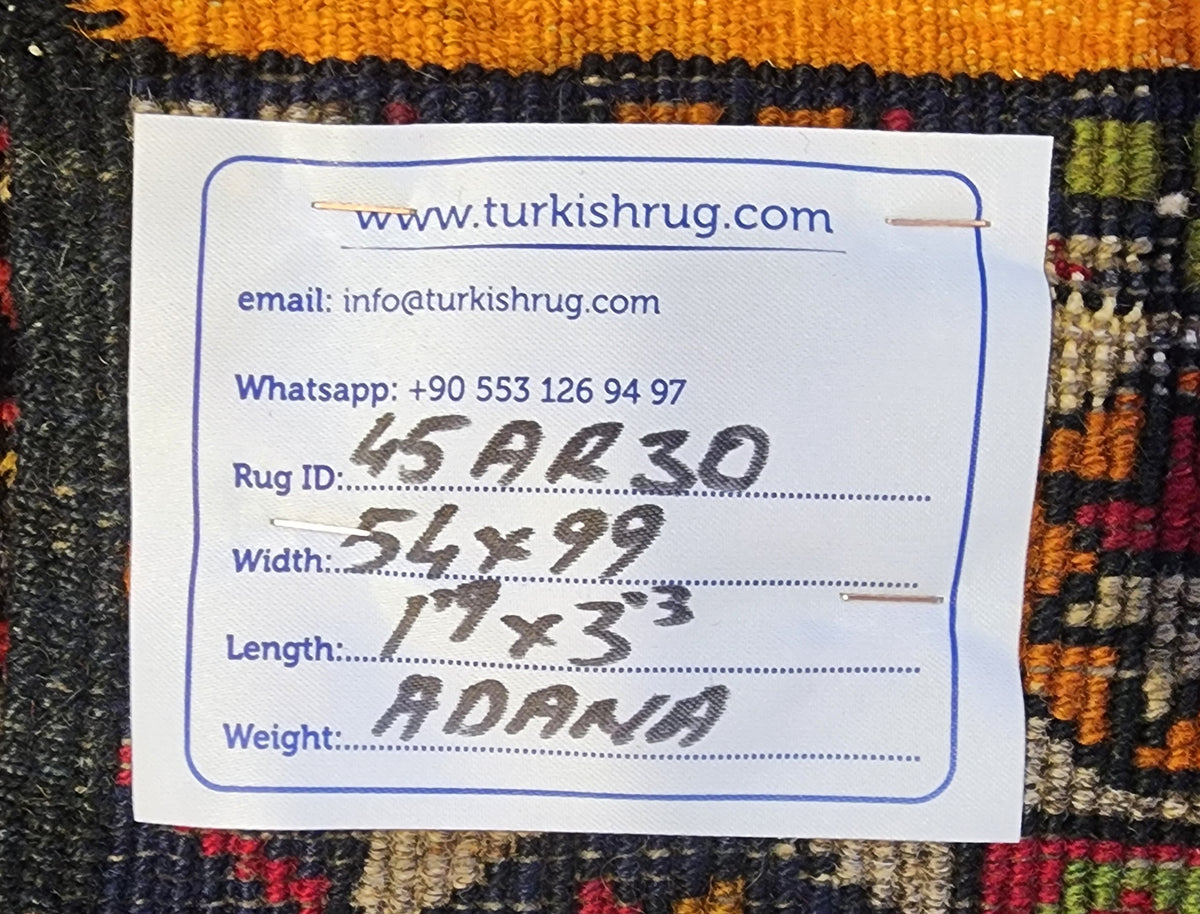 Vintage Adana rug in brown, blue and white, 1'9" x 3'3", back of the rug with the hand-written label