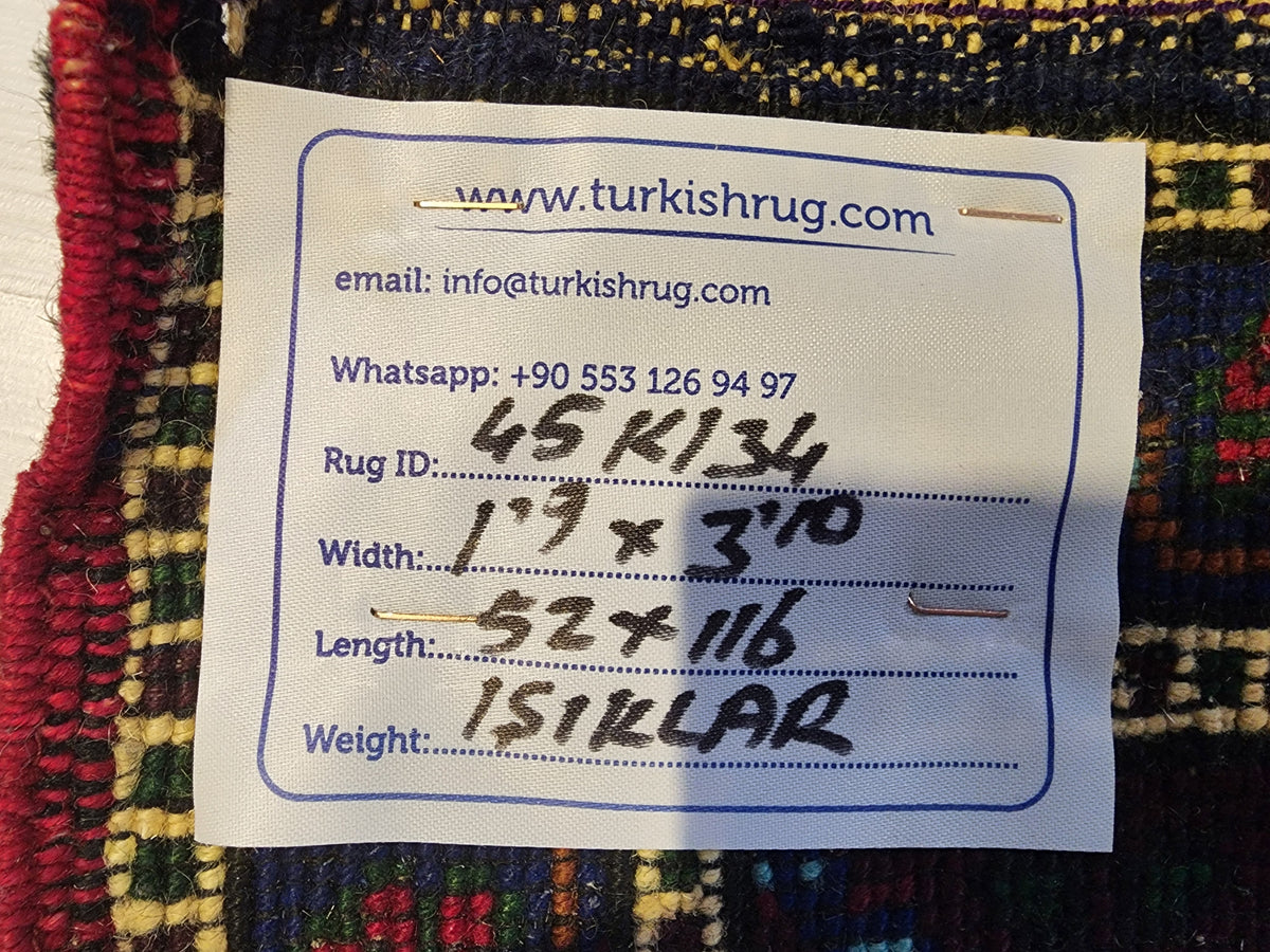 Vintage Işıklar rug in blue, red and white, 1'9" x 3'10", back of the rug with the hand-written label
