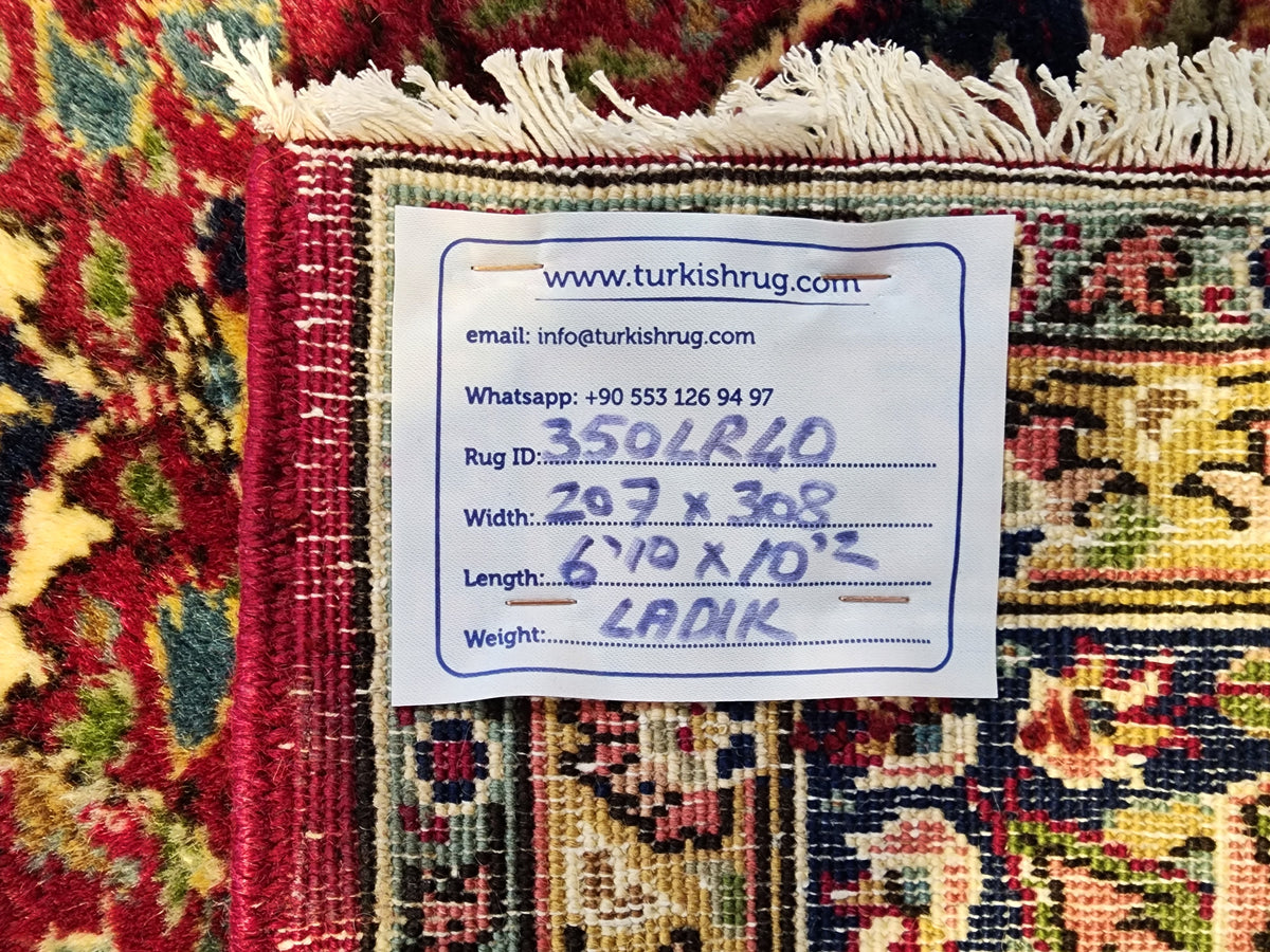 Vintage Ladik medallion rug in red, blue and beige, 6'10" x 10'2", back of the rug with the hand-written label