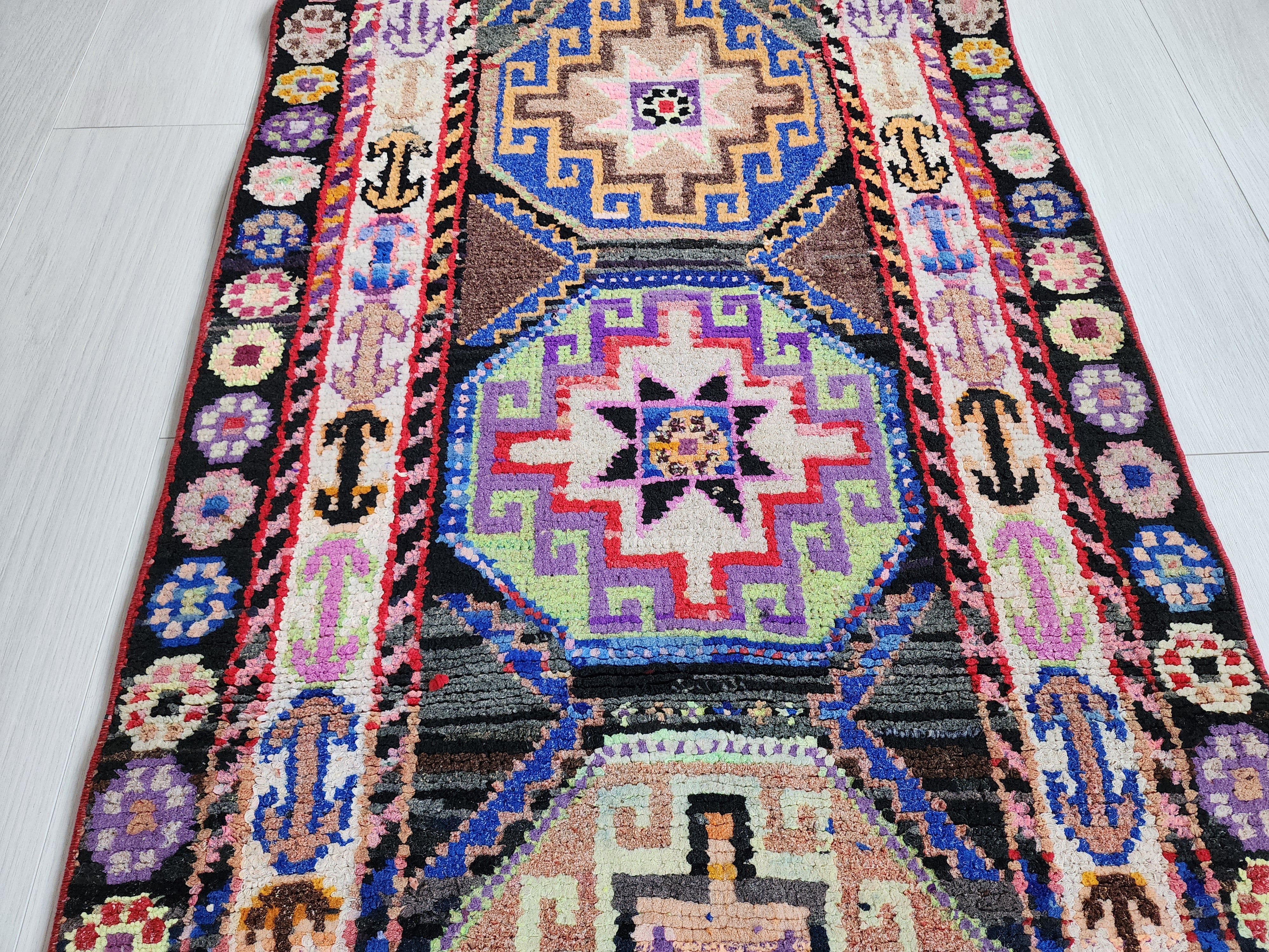 Vibrant Tribal Herki Runner with Geometric Medallions